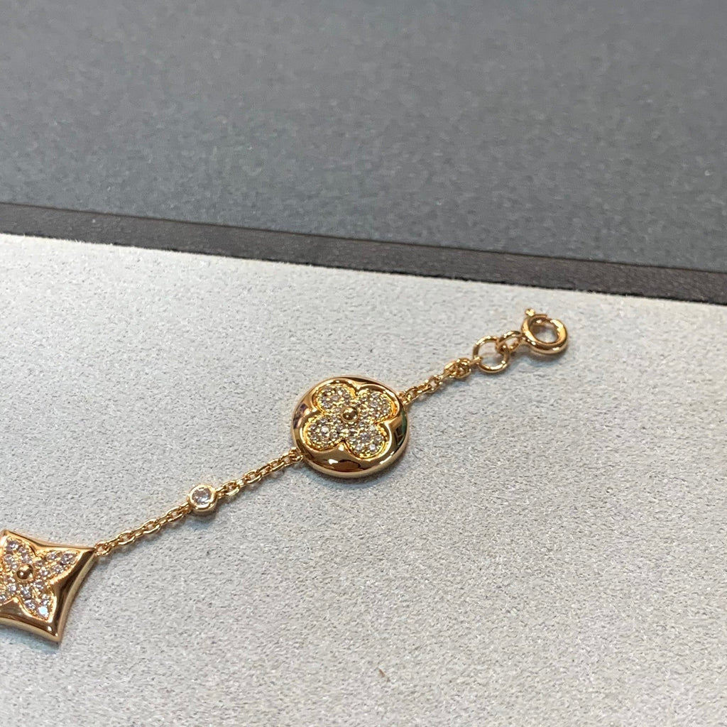 ??MIRA?¡¥STAR AND SUN 4 MOTIFS GOLD DIAMONDS BRACELET