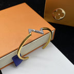 ??MIRA?¡¥VOLTE UPSITE DOWN DIAMOND GOLD OPEN BRACELET