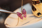 ??MIRA?¡¥BUTTERFLY RED DIAMOND ROSE GOLD NECKLACE