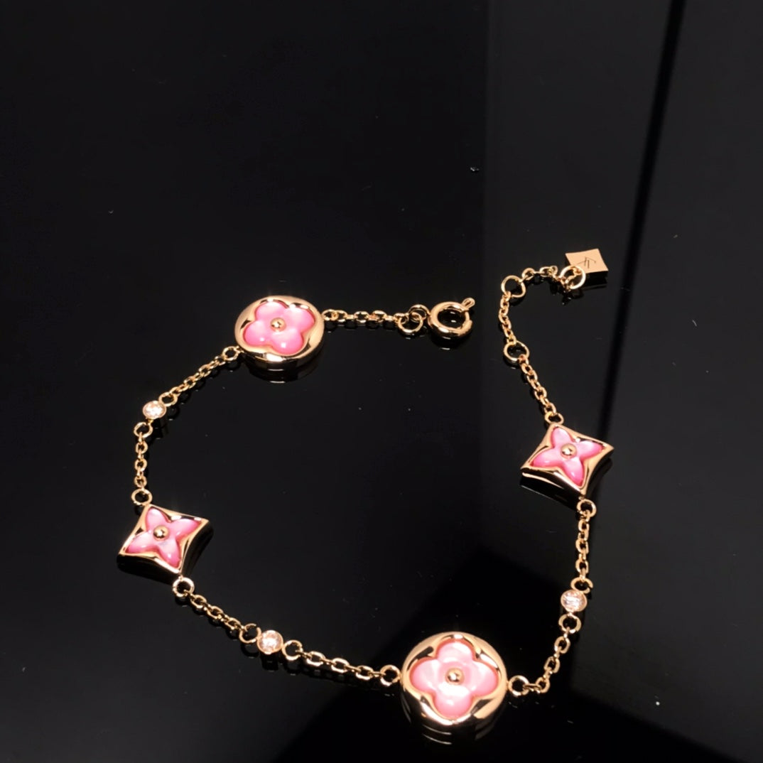??MIRA?¡¥STAR AND SUN 4 MOTIF PINK MOP PINK GOLD BRACELET