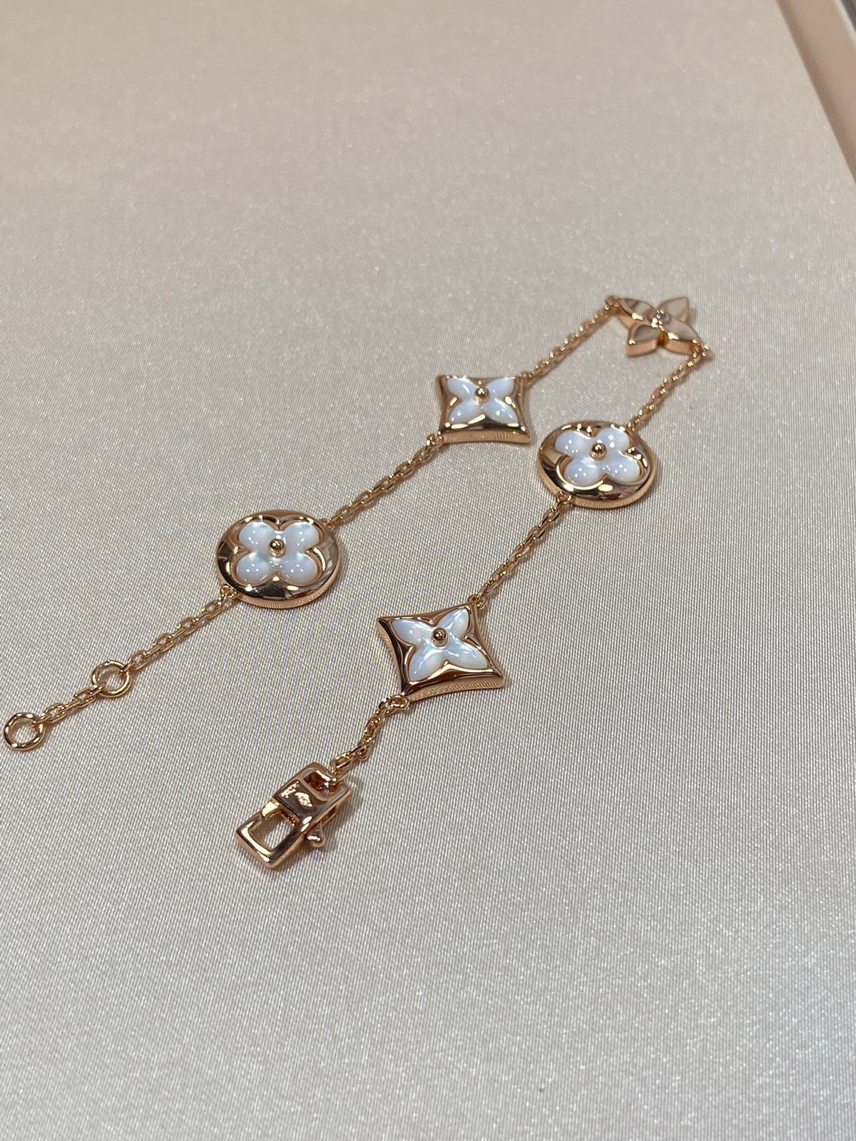 ??MIRA?¡¥STAR AND SUN 5 MOTIF MOP PINK GOLD BRACELET