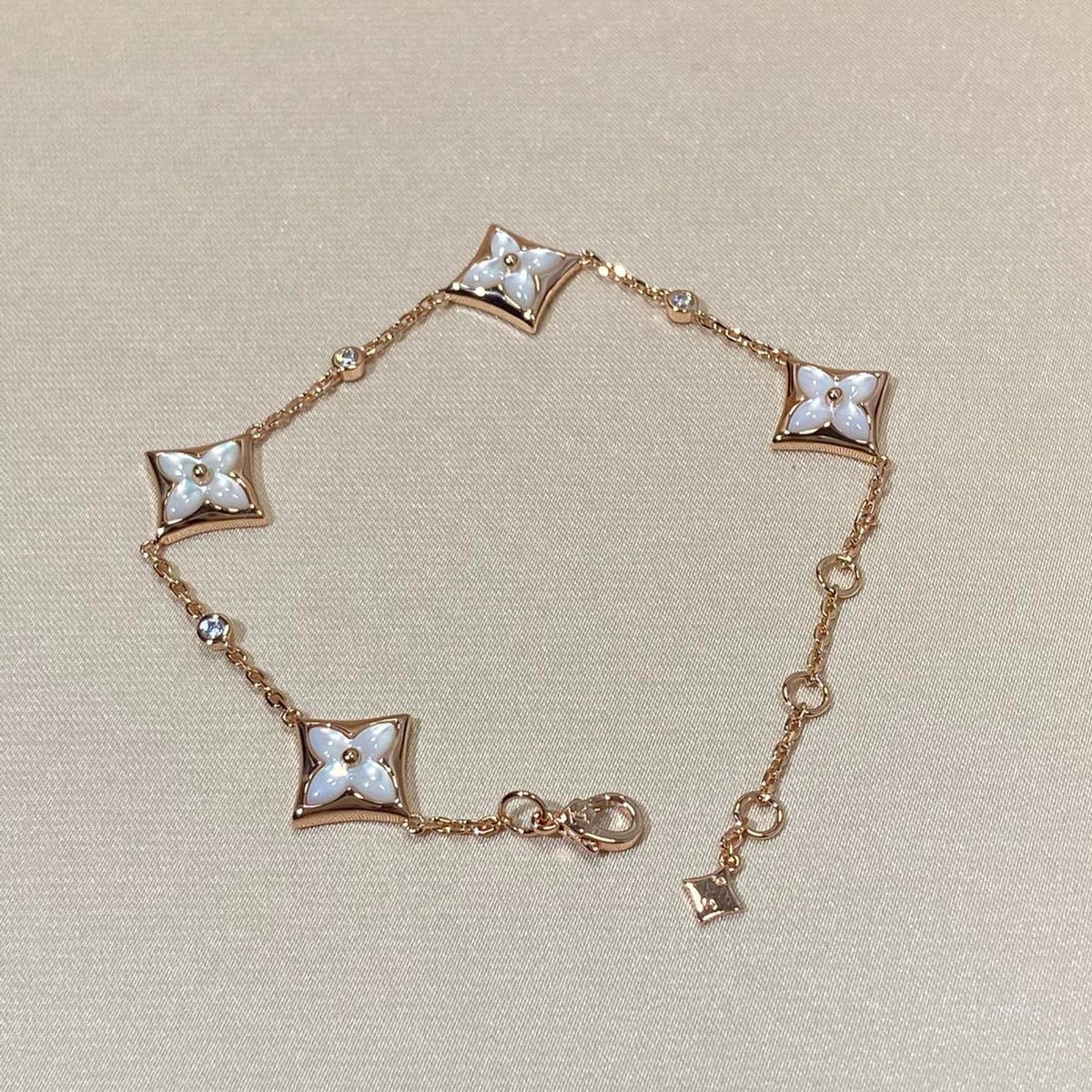 ??MIRA?¡¥STAR 4 MOTIF MOP DIAMOND PINK GOLD BRACELET