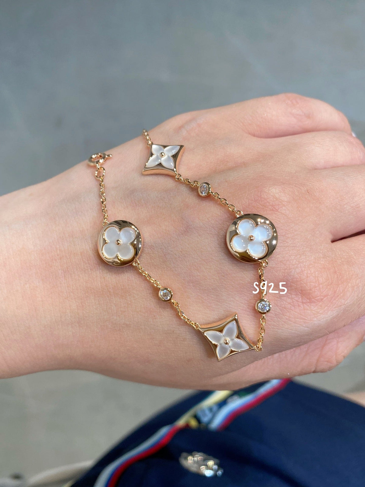 ??MIRA?¡¥STAR AND SUN 4 MOTIF WHITE MOP PINK GOLD BRACELET