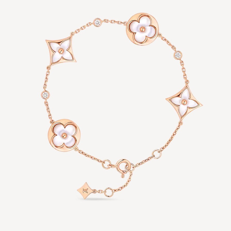 ??MIRA?¡¥STAR AND SUN 4 MOTIF WHITE MOP PINK GOLD BRACELET