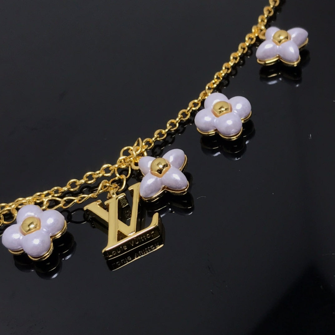 ??MIRA?¡¥LOGO 6 MOTIF STAR AND SUN GOLD BRACELET