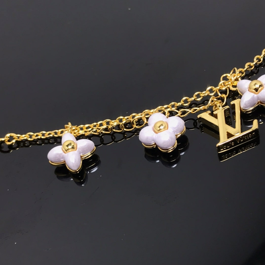 ??MIRA?¡¥LOGO 6 MOTIF STAR AND SUN GOLD BRACELET