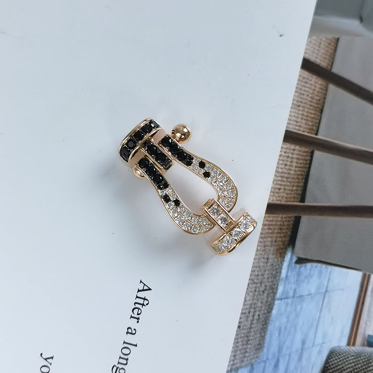 ??MIRA?¡¥FORCE LARGE HORSESHOE BLACK WHITE DIAMOND BRACELET SILVER