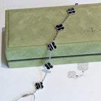 ??MIRA?¡¥CLOVER 5 MOTIF VEINED ONYX BRACELET SILVER