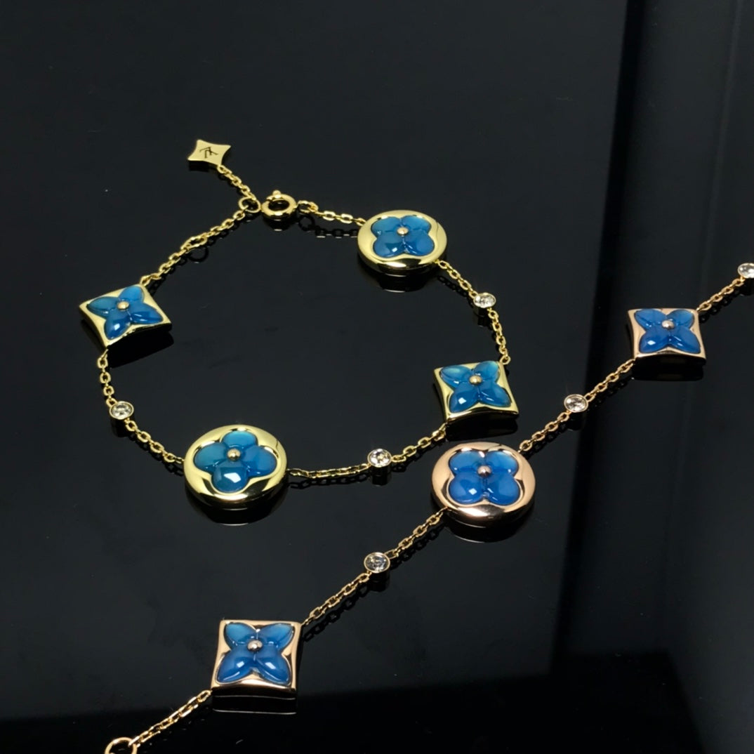 ??MIRA?¡¥STAR AND SUN 4 MOTIF BLUE BRACELET