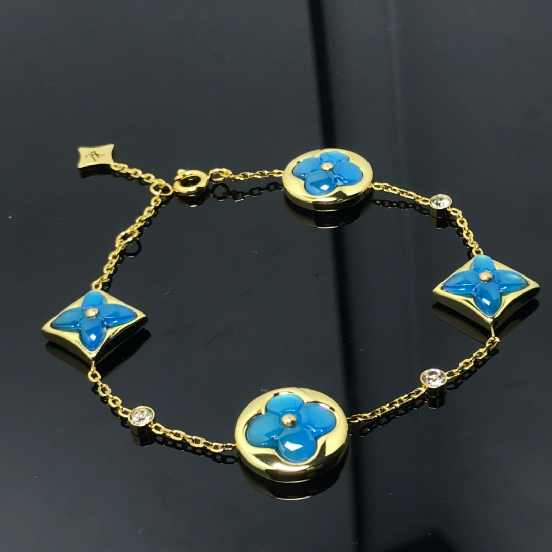??MIRA?¡¥STAR AND SUN 4 MOTIF BLUE BRACELET